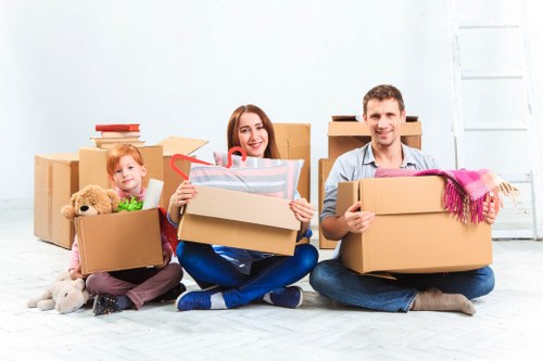 Storage team sorting cardboard and recyclable packaging in a sustainable facilities setting