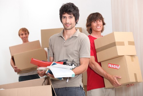 Employee wearing PPE while moving storage items
